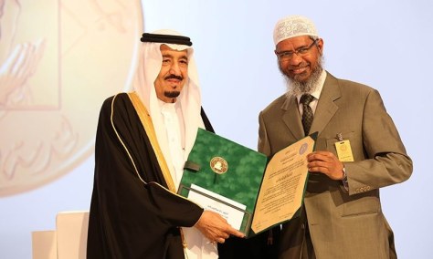A handout picture released by the King Faisal Foundation on March 1, 2015 shows Saudi King Salman bin Abdul Aziz (L) presenting Zakir Naik, president of the Islamic Research Foundation in India, with the 2015 King Faisal International Prize for Service to Islam in Riyadh. — AFP 
